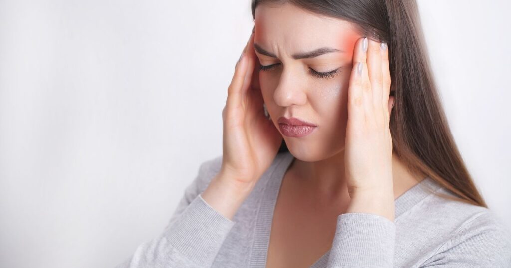 A woman with a migraine.